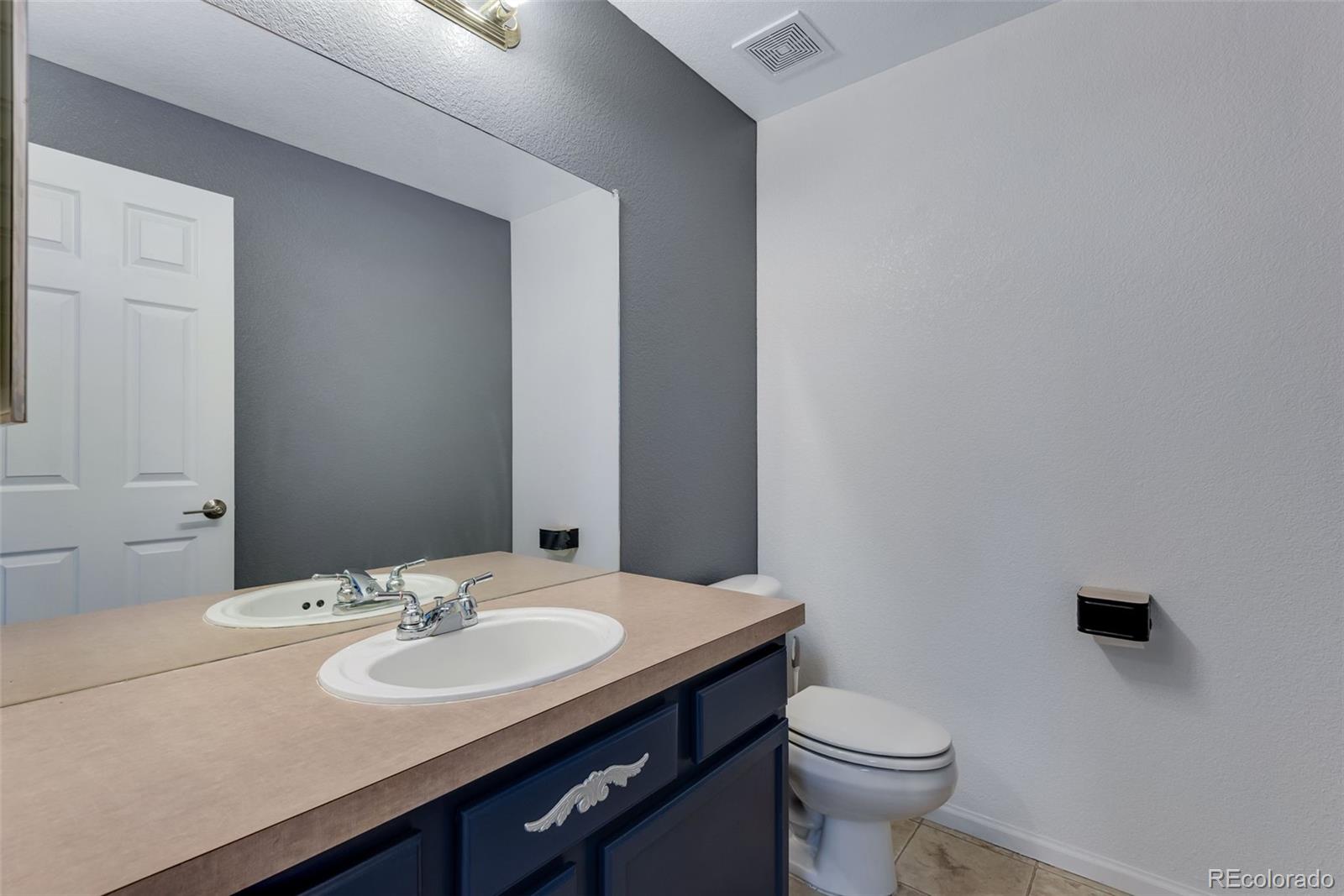 1405 South Chambers Road, Unit 103 Aurora, CO 80017 - Photo 11 of 20 a bathroom with a sink and a toilet