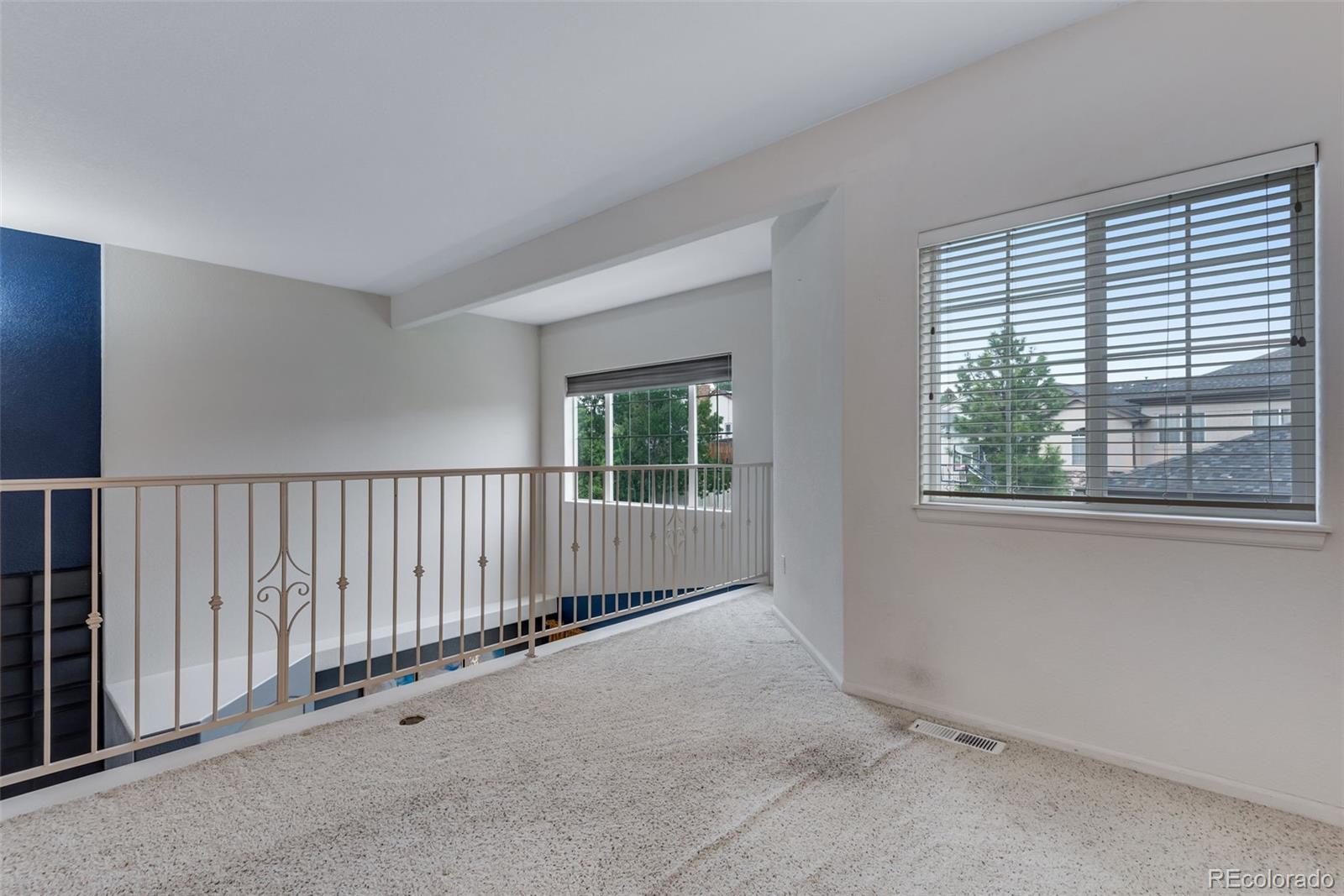 1405 South Chambers Road, Unit 103 Aurora, CO 80017 - Photo 13 of 20 a view of an empty room with a window