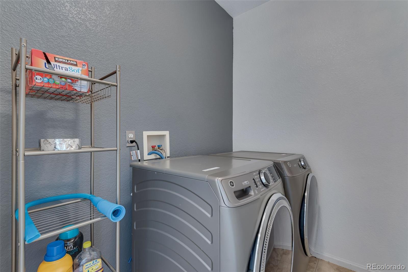 1405 South Chambers Road, Unit 103 Aurora, CO 80017 - Photo 14 of 20 a utility room with dryer and washer