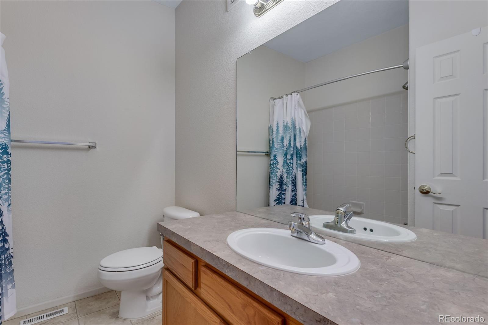1405 South Chambers Road, Unit 103 Aurora, CO 80017 - Photo 17 of 20 a bathroom with a sink and a toilet