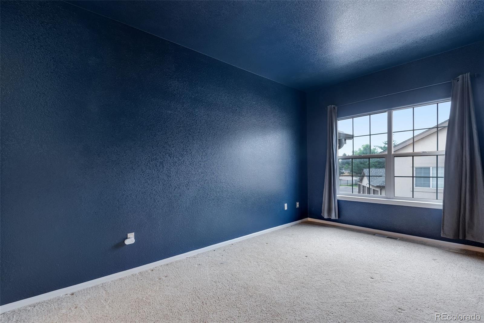 1405 South Chambers Road, Unit 103 Aurora, CO 80017 - Photo 18 of 20 an empty room with a window