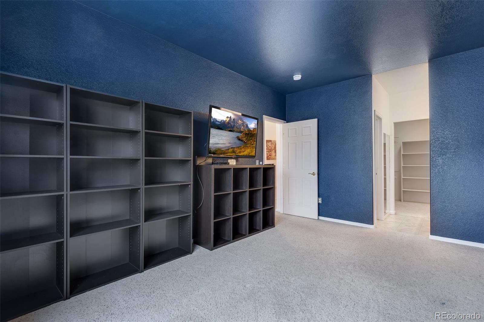 1405 South Chambers Road, Unit 103 Aurora, CO 80017 - Photo 19 of 20 a view of empty room with shelves