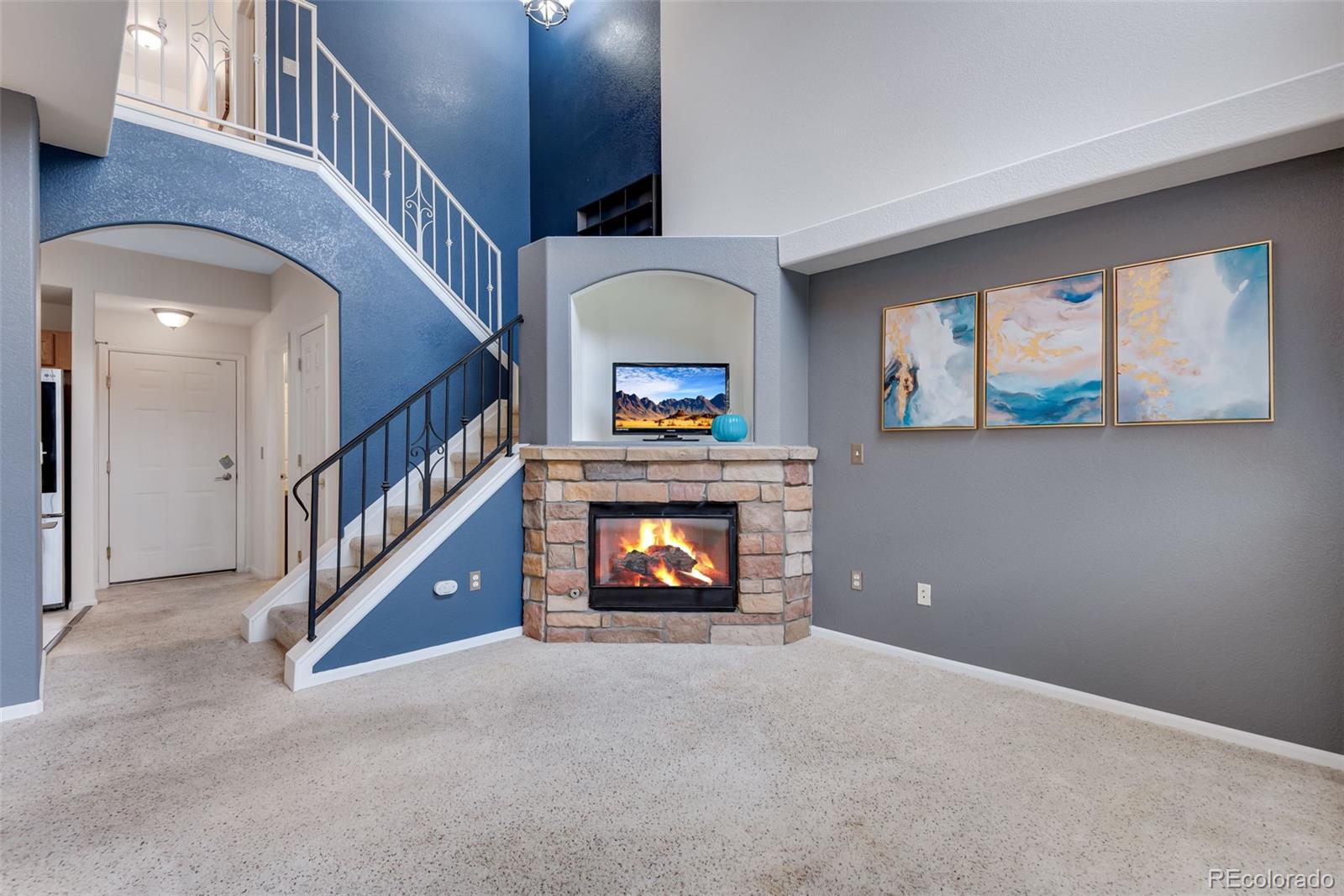 1405 South Chambers Road, Unit 103 Aurora, CO 80017 - Photo 5 of 20 a view of an entryway and hall with wooden floor