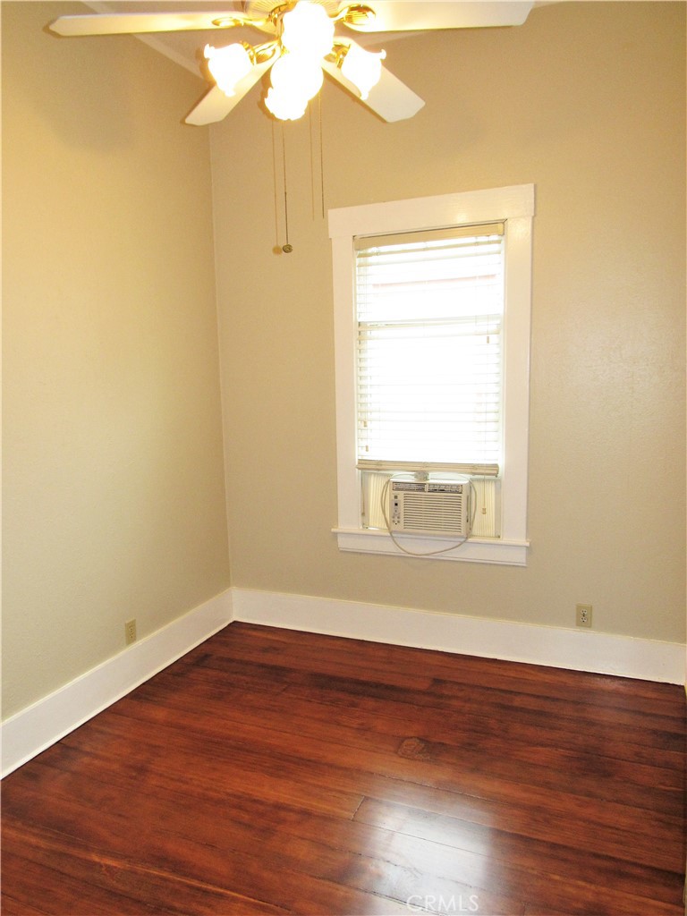 478 South Grand Street Orange, CA 92866 - Photo 7 of 10 a view of an empty room with wooden floor and a window