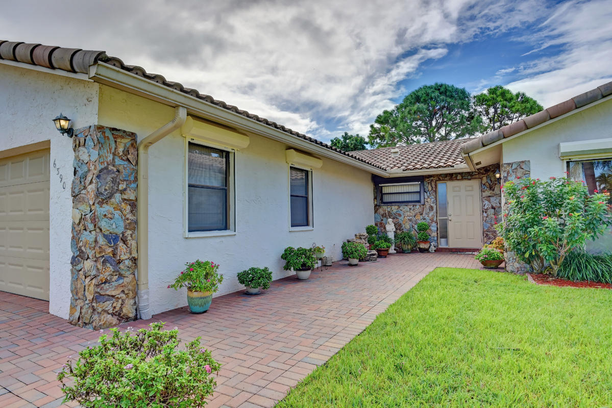 6390 Woodbury Road Boca Raton, FL 33433 - Photo 2 of 24 Paved entrance walkway