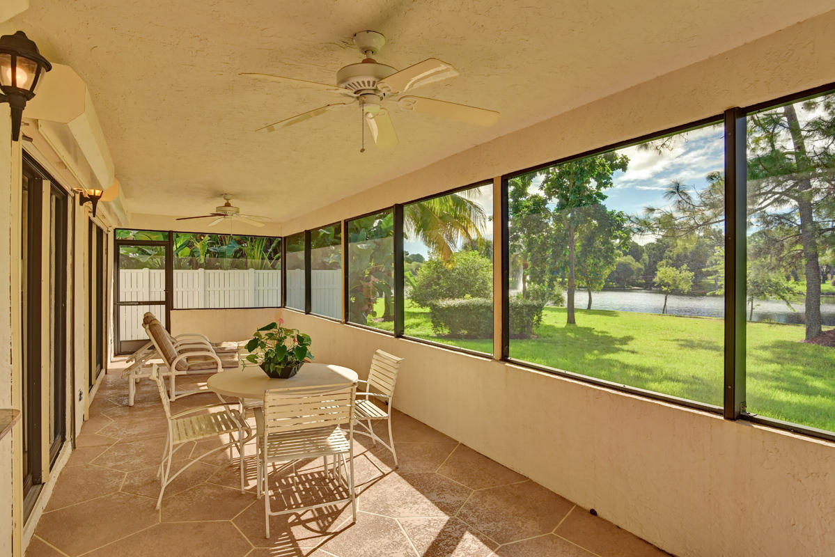 6390 Woodbury Road Boca Raton, FL 33433 - Photo 4 of 24 Screened lanai with lakeview