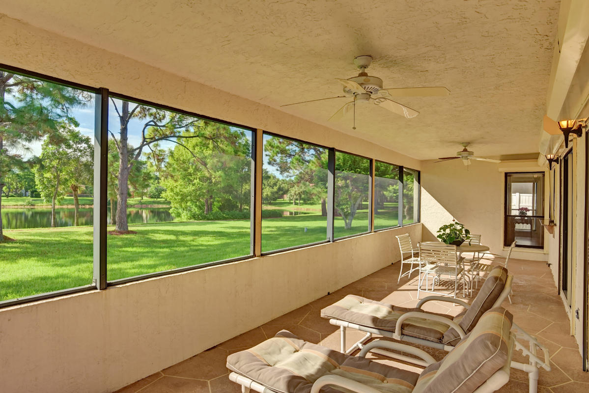6390 Woodbury Road Boca Raton, FL 33433 - Photo 5 of 24 Screened lanai with lakeview