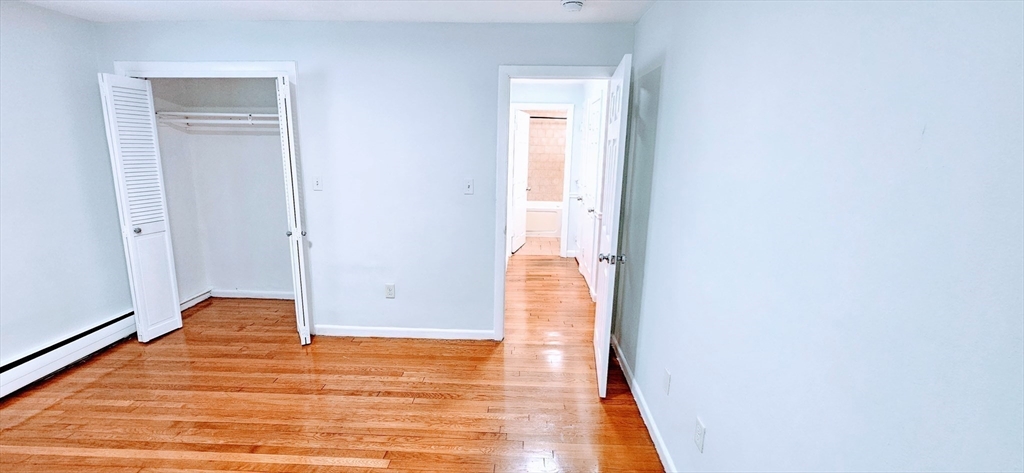7 Oakcrest Road, Unit 6 Boston, MA 02136 - Photo 6 of 10 a view of empty room with wooden floor