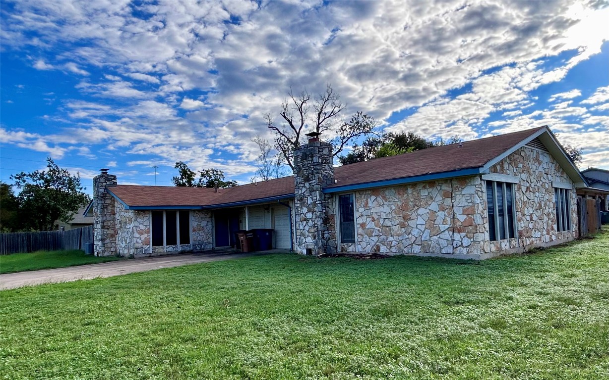 12005 Charing Cross Road, Unit A Austin, TX 78759 - Photo 1 of 19 a view of a house with a yard potted plants and large tree