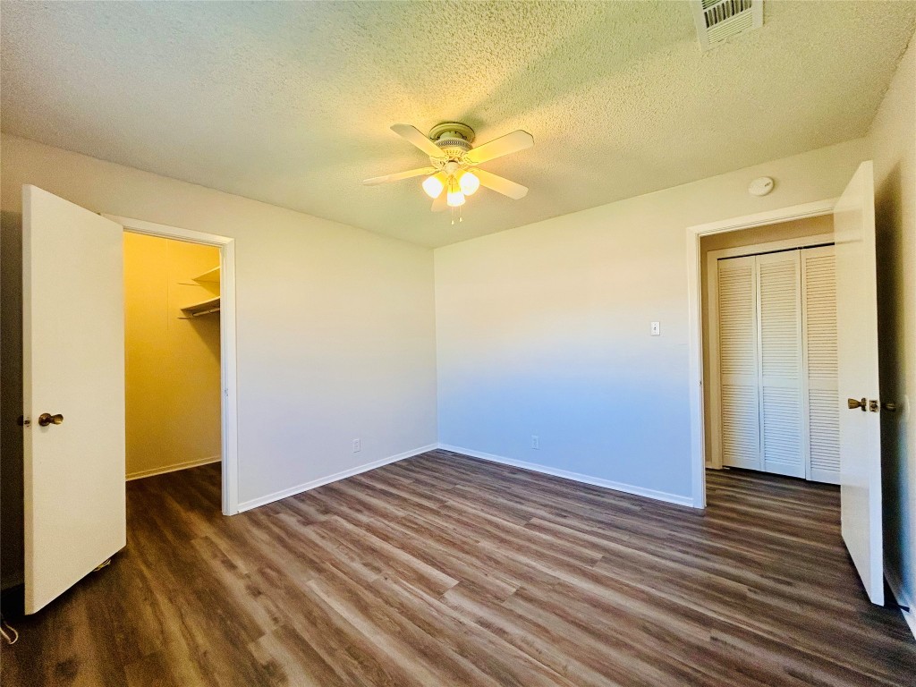 12005 Charing Cross Road, Unit A Austin, TX 78759 - Photo 14 of 19 a view of empty room with wooden floor