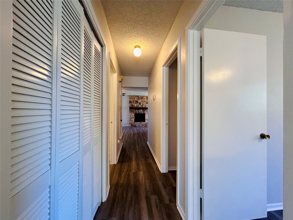 12005 Charing Cross Road, Unit A Austin, TX 78759 - Photo 8 of 19 a view of hallway with wooden floor