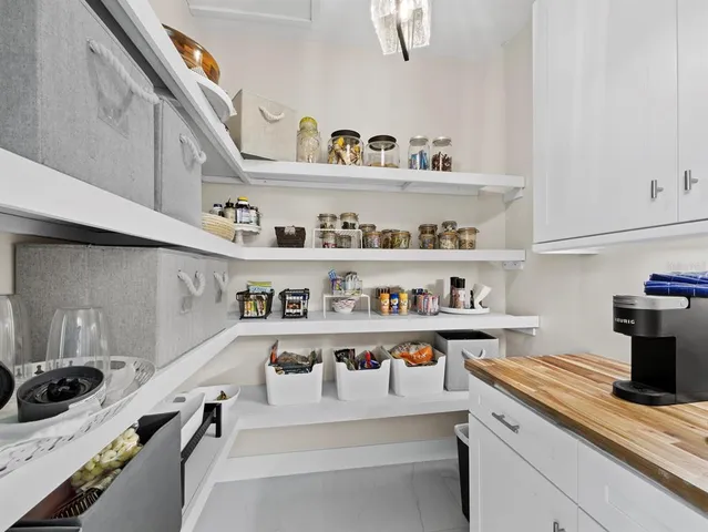 a view of a porch with furniture and backyard