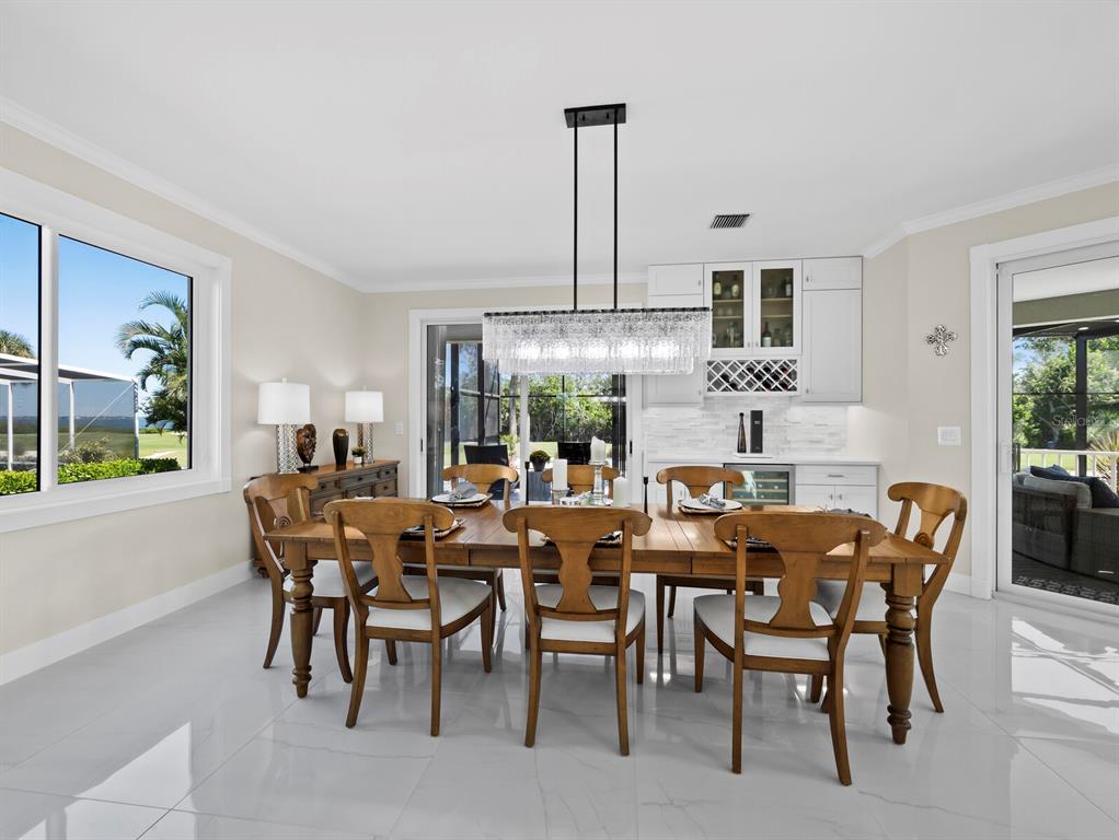 3408 Fair Oaks Lane Longboat Key, FL 34228 - Photo 13 of 76 a view of a dining room with furniture window and outside view