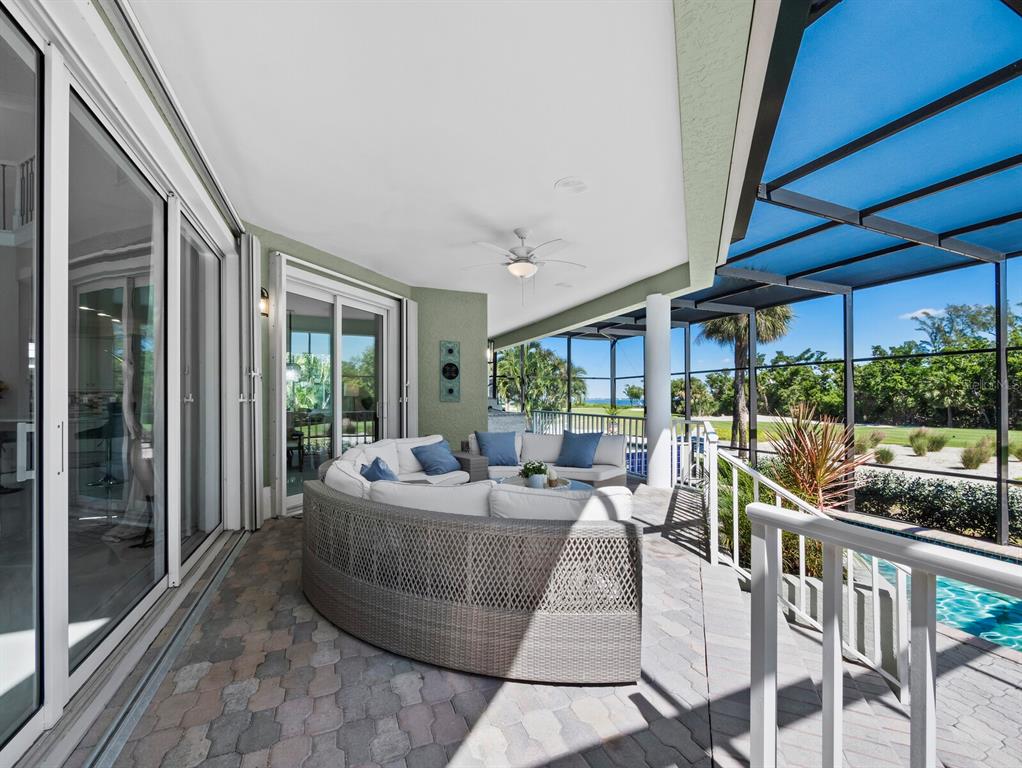 3408 Fair Oaks Lane Longboat Key, FL 34228 - Photo 17 of 76 a living room with furniture and a floor to ceiling window