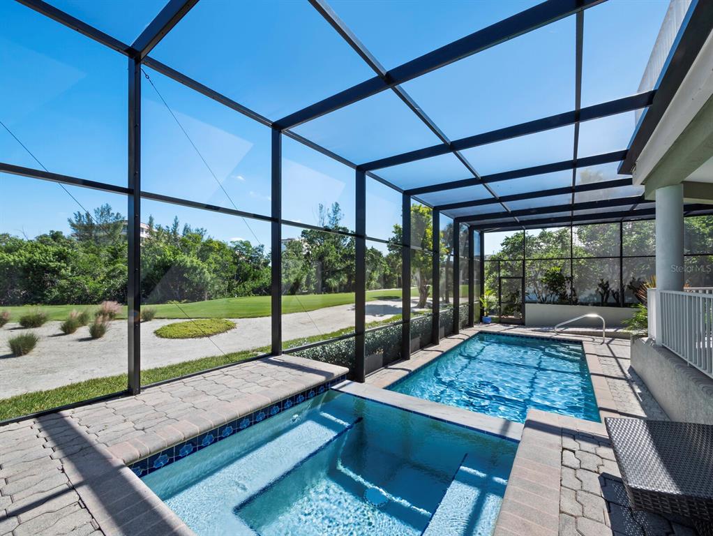 3408 Fair Oaks Lane Longboat Key, FL 34228 - Photo 21 of 76 a view of a patio with a table chairs and a patio