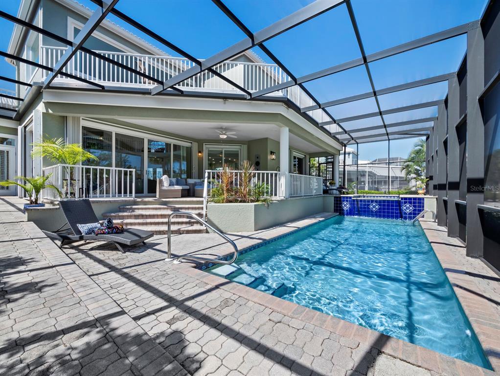 3408 Fair Oaks Lane Longboat Key, FL 34228 - Photo 22 of 76 a view of a house with backyard porch and sitting area