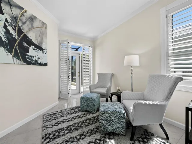 a bathroom with a sink a toilet and a large mirror