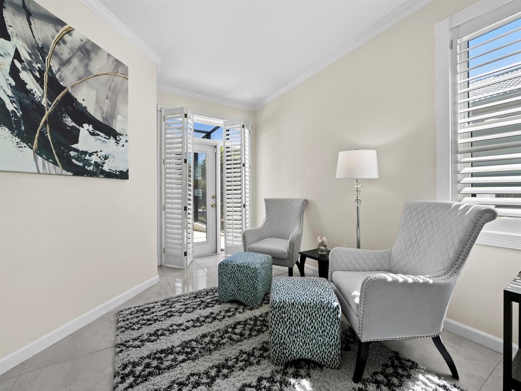 3408 Fair Oaks Lane Longboat Key, FL 34228 - Photo 27 of 76 a living room with furniture and a window