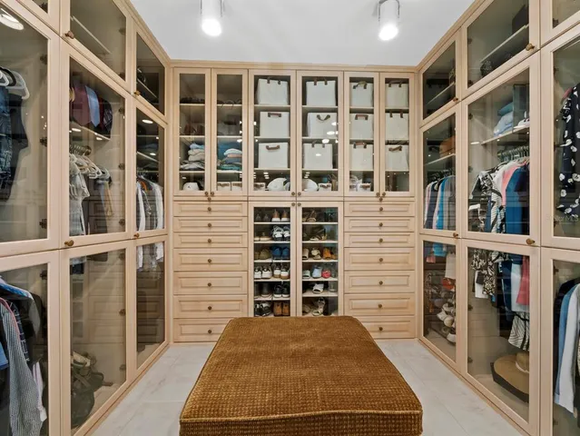 a bedroom with bed and window