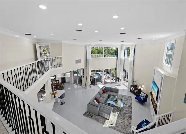 a view of a chairs and table in the balcony