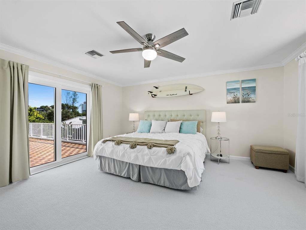 3408 Fair Oaks Lane Longboat Key, FL 34228 - Photo 34 of 76 a bedroom with a bed and window