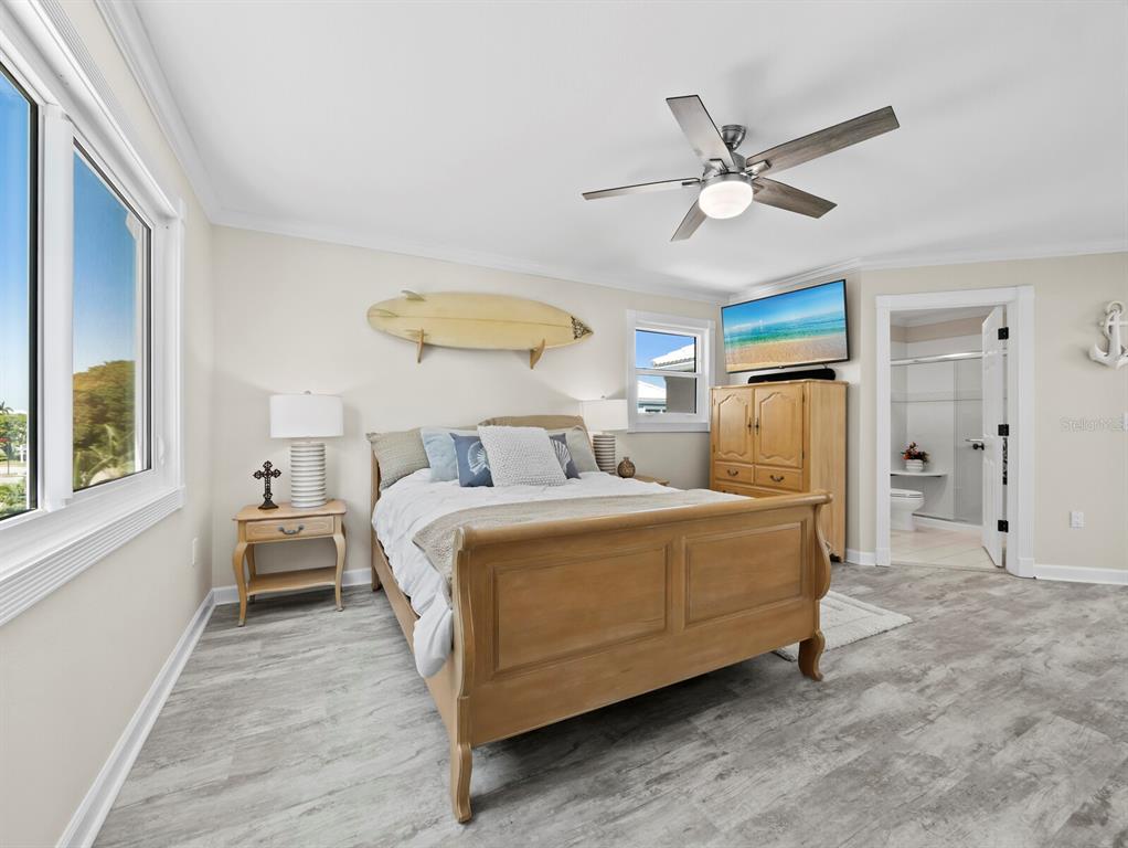 3408 Fair Oaks Lane Longboat Key, FL 34228 - Photo 39 of 76 a bedroom with bed and window