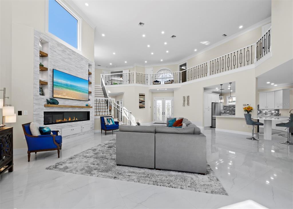 3408 Fair Oaks Lane Longboat Key, FL 34228 - Photo 4 of 76 a living room with furniture and a flat screen tv