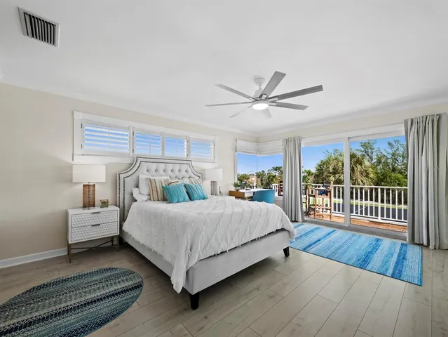 an aerial view of a house with a garden and lake view