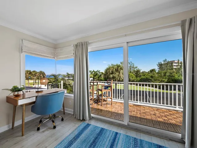 an aerial view of residential houses with outdoor space and swimming pool