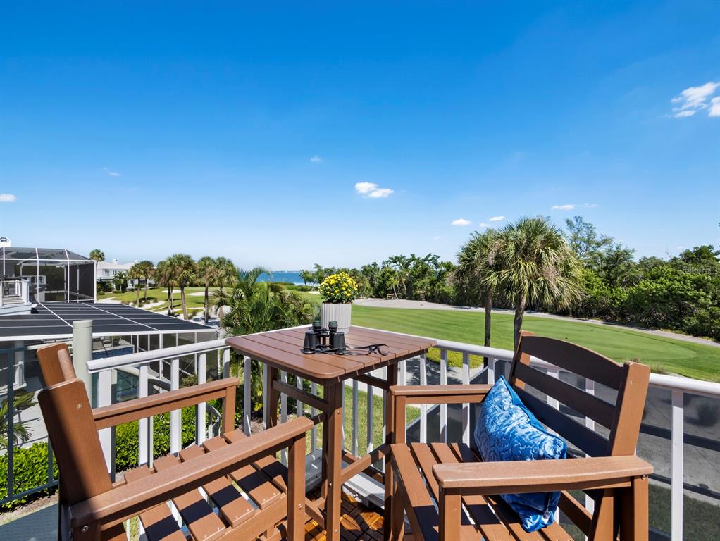 3408 Fair Oaks Lane Longboat Key, FL 34228 - Photo 45 of 76 a view of a chairs and table in the patio