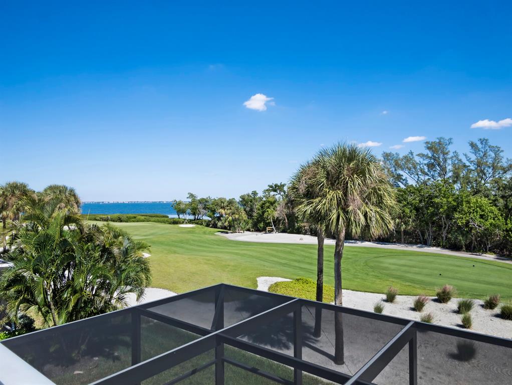 3408 Fair Oaks Lane Longboat Key, FL 34228 - Photo 46 of 76 a view of a swimming pool with a yard
