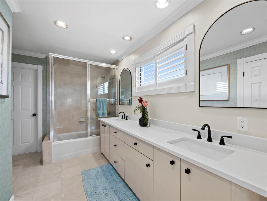 3408 Fair Oaks Lane Longboat Key, FL 34228 - Photo 50 of 76 a bathroom with a granite countertop sink mirror and double