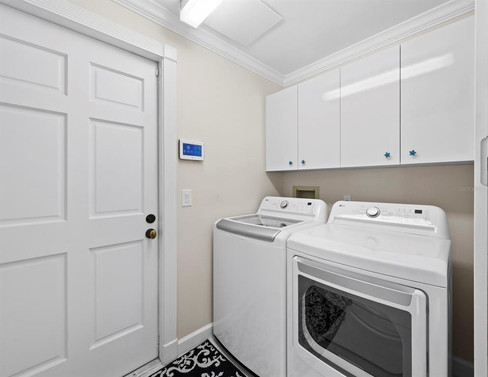 3408 Fair Oaks Lane Longboat Key, FL 34228 - Photo 51 of 76 a utility room with dryer and washer