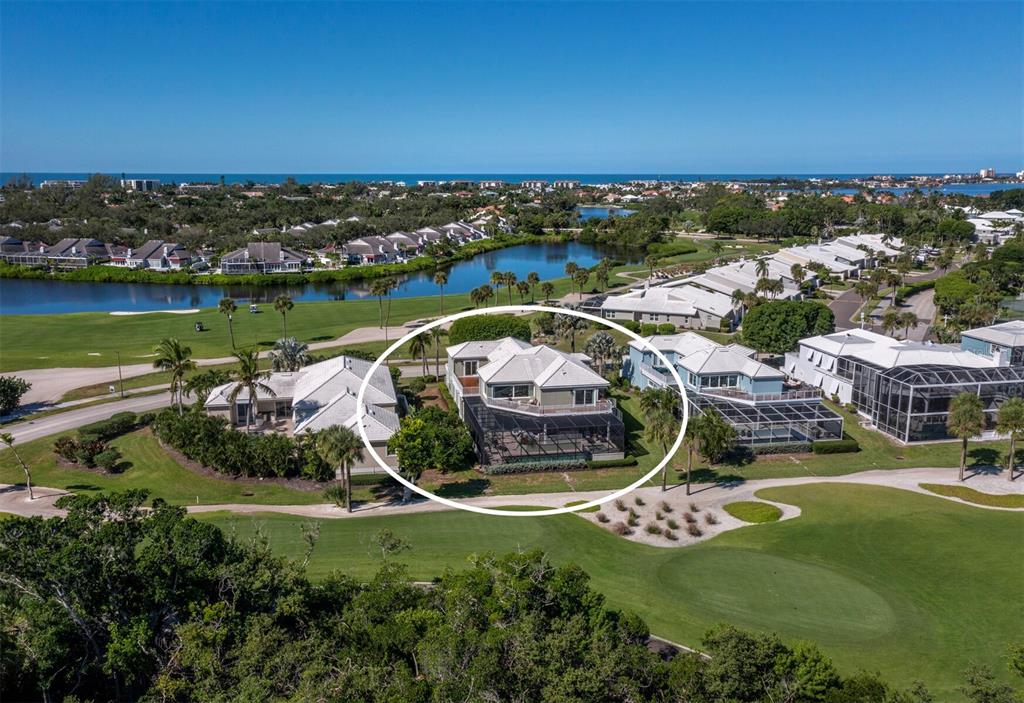 3408 Fair Oaks Lane Longboat Key, FL 34228 - Photo 53 of 76 an aerial view of a house with a garden and lake view