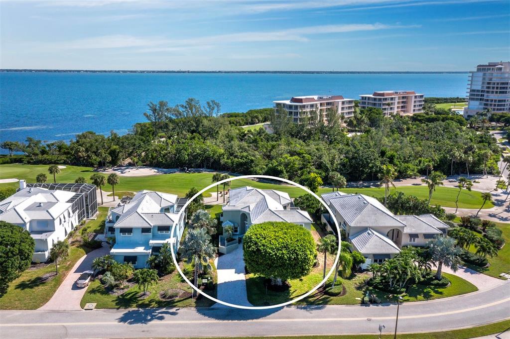 3408 Fair Oaks Lane Longboat Key, FL 34228 - Photo 54 of 76 an aerial view of a house with a garden and lake view