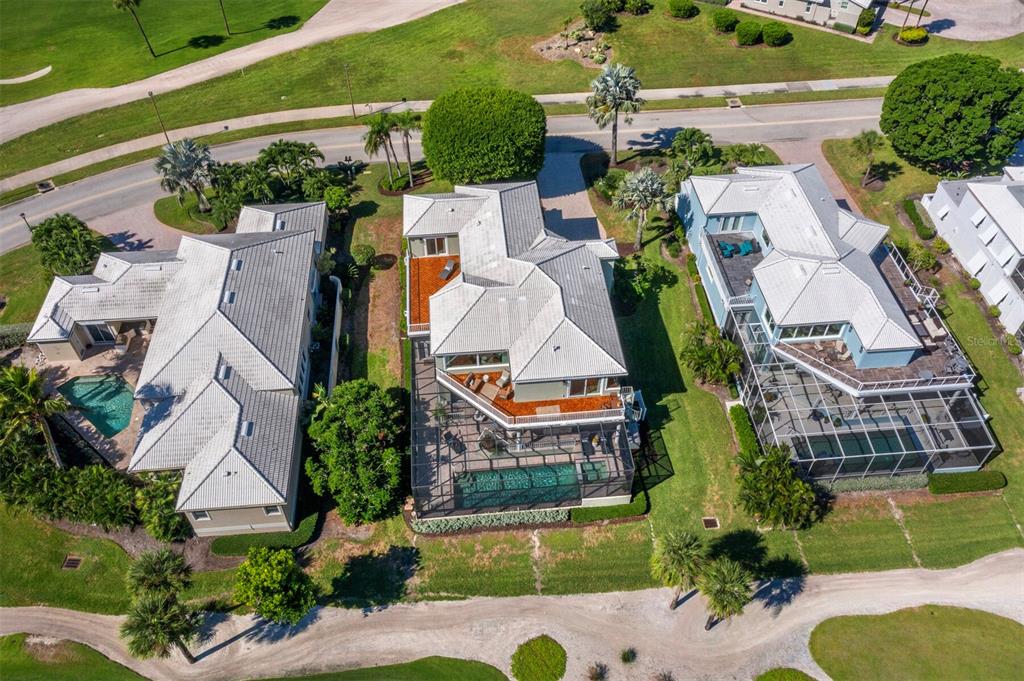 3408 Fair Oaks Lane Longboat Key, FL 34228 - Photo 58 of 76 an aerial view of a house with a garden and plants