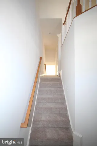 a view of a hallway with stairs