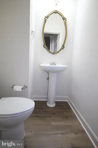 a kitchen with a refrigerator a sink and cabinets