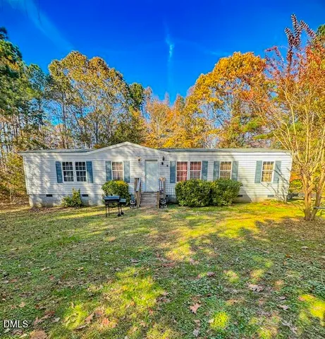 front view of a house with a big yard