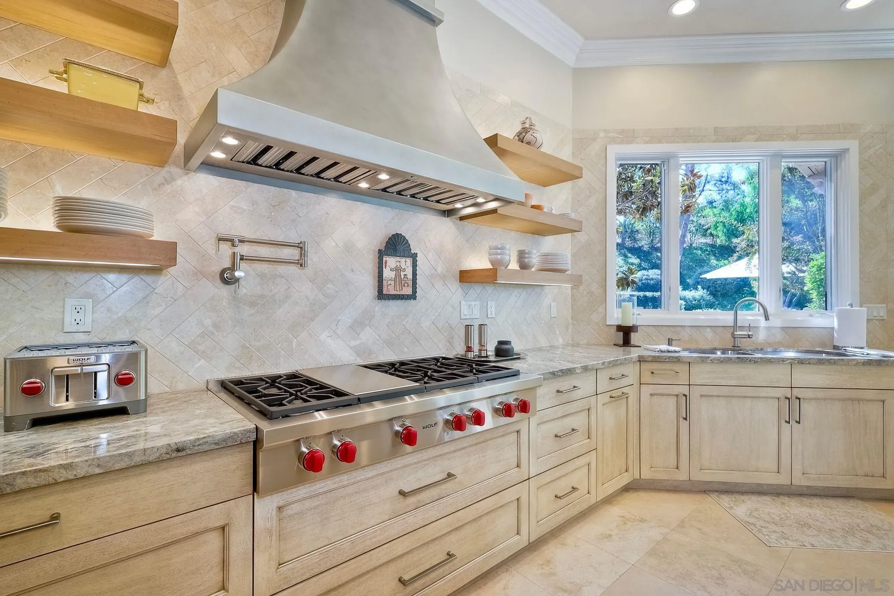 17732 Vineyard Lane Poway, CA 92064 - Photo 12 of 63 a kitchen with granite countertop a sink a stove and a window