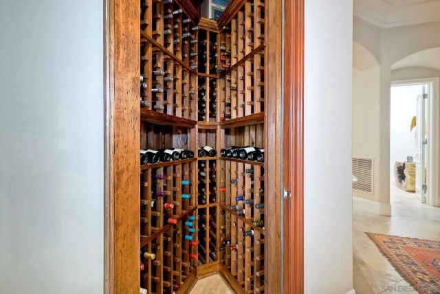 a living room with furniture fireplace and a large window