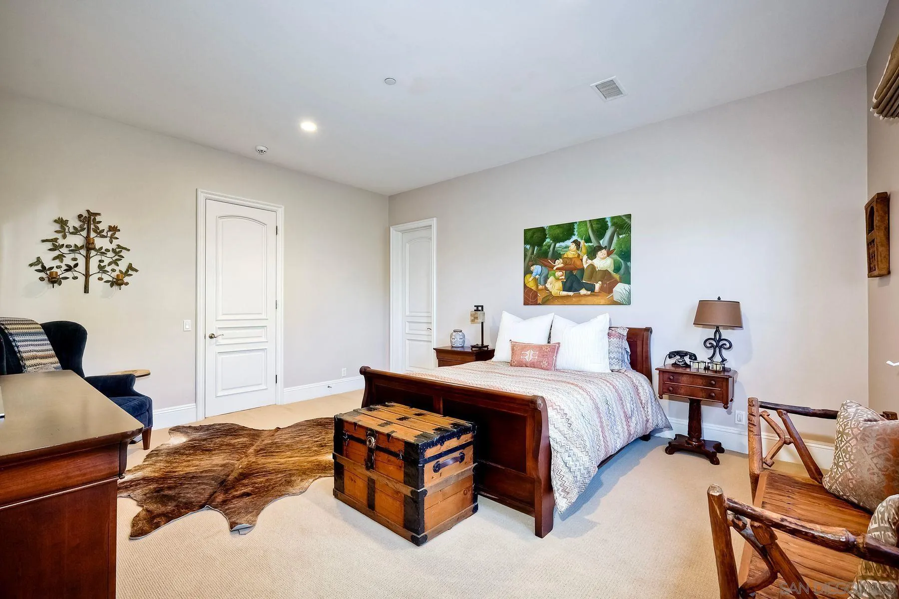 17732 Vineyard Lane Poway, CA 92064 - Photo 24 of 63 a spacious bedroom with a bed and a dresser in it