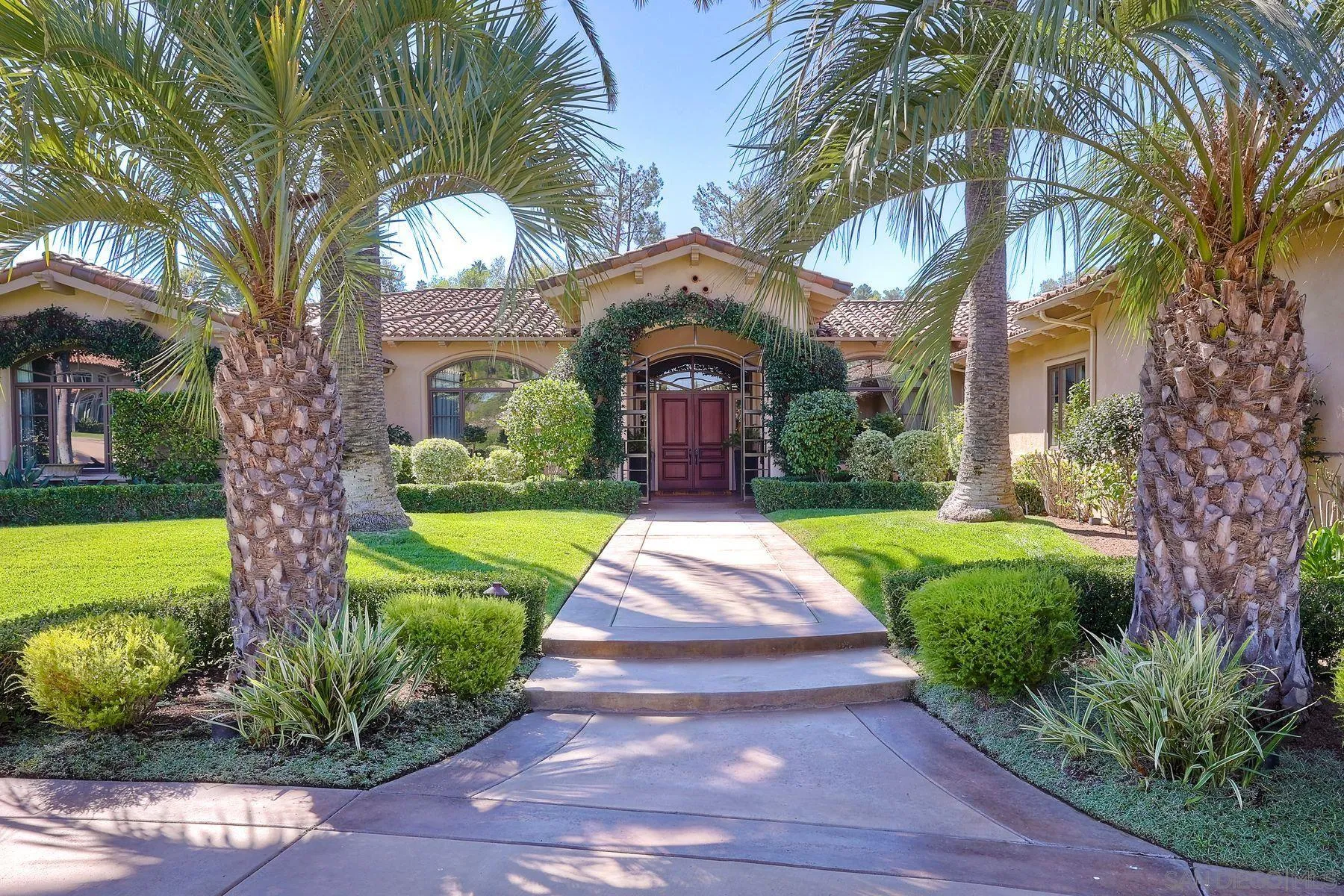17732 Vineyard Lane Poway, CA 92064 - Photo 4 of 63 a front view of a house with garden and entertaining space