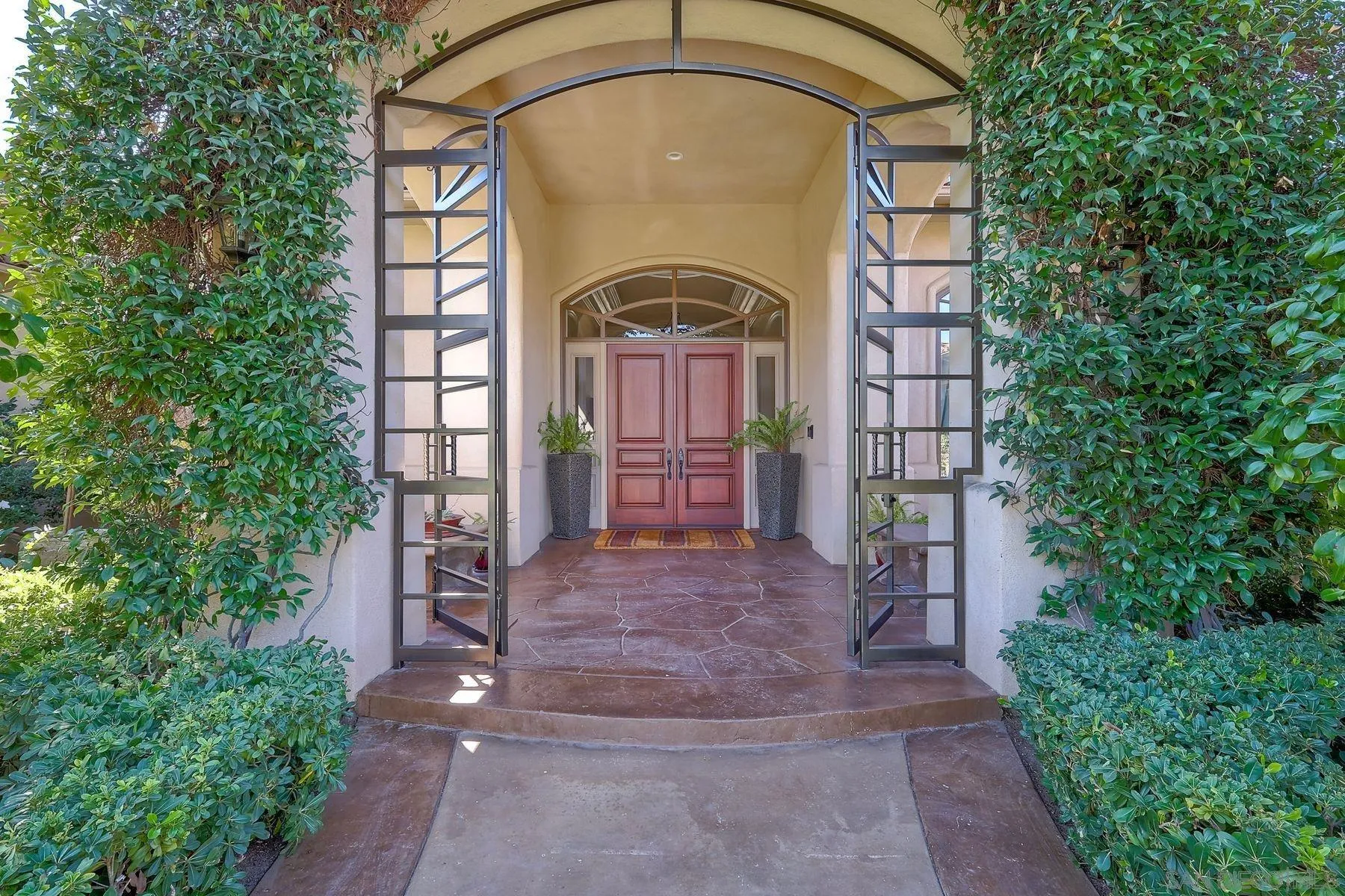 17732 Vineyard Lane Poway, CA 92064 - Photo 5 of 63 a front view of a house with a garden