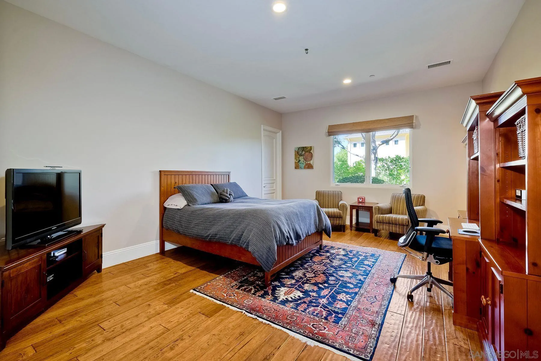 17732 Vineyard Lane Poway, CA 92064 - Photo 63 of 63 a bedroom with furniture and a flat screen tv