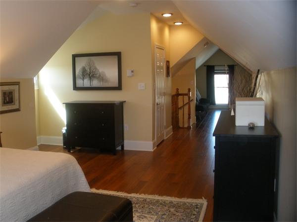 5 Crescent Hill Wakefield, MA 01880 - Photo 11 of 24 a bedroom with furniture and a fireplace