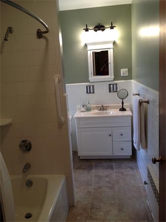 5 Crescent Hill Wakefield, MA 01880 - Photo 18 of 24 a bathroom with a tub sink and mirror