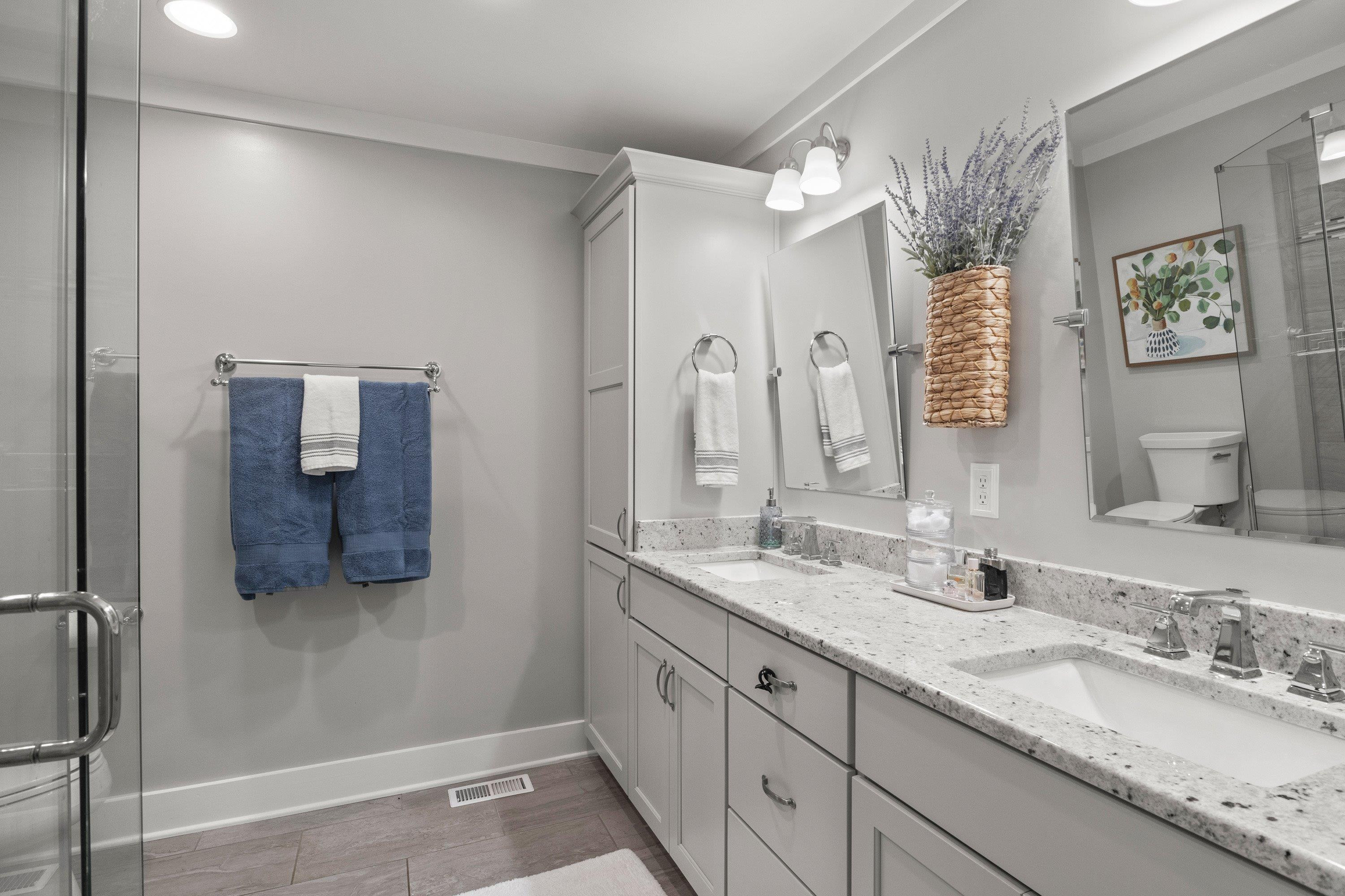 2420 Windsor Trail Raleigh, NC 27615 - Photo 31 of 72 a bathroom with a granite countertop double vanity sink and mirror