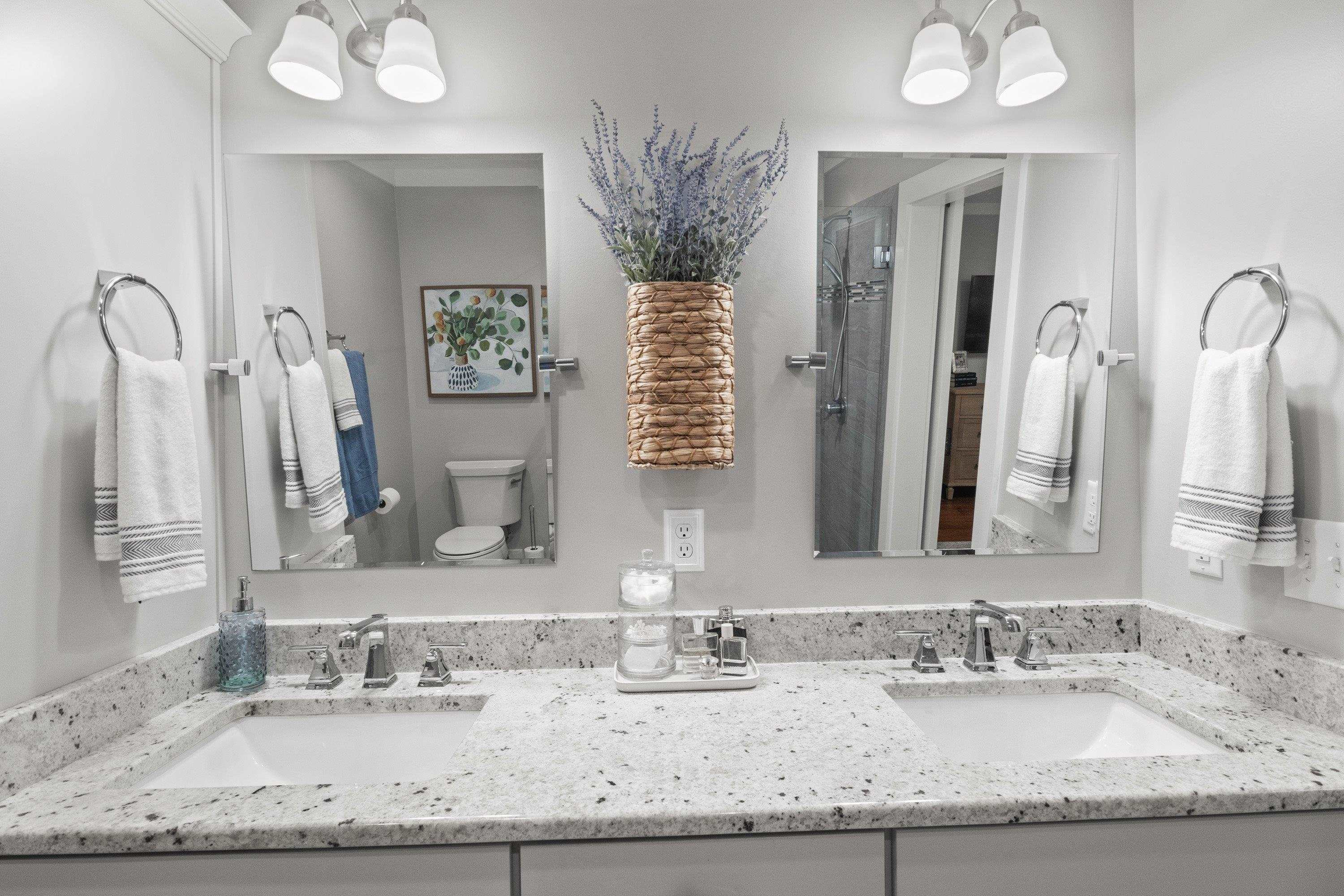 2420 Windsor Trail Raleigh, NC 27615 - Photo 34 of 72 a bathroom with double vanity sinks granite vanity and a mirror