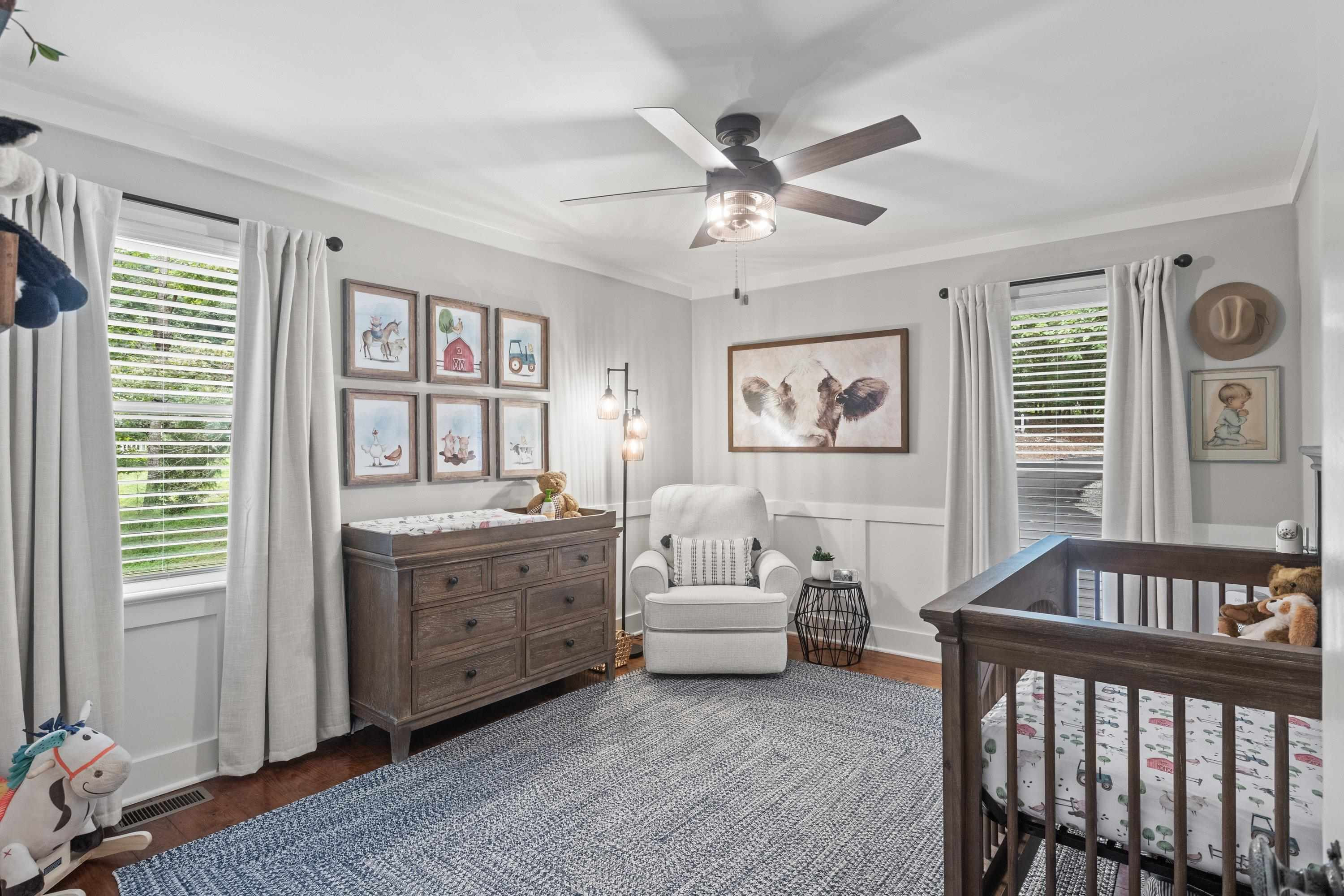 2420 Windsor Trail Raleigh, NC 27615 - Photo 36 of 72 a spacious bedroom with a bed and a chandelier